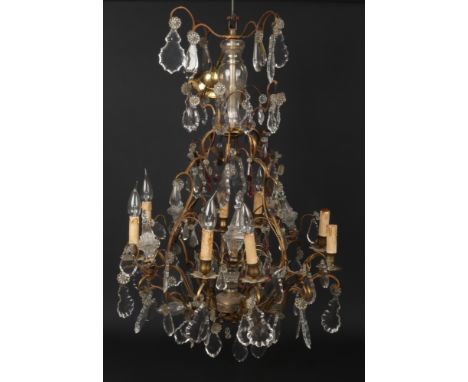 An early-mid 20th century French gilt metal and cut crystal eight branch chandelier, 90cm.  Good condition but lacking the pe