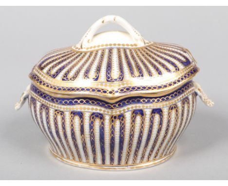 A rare Caughley sauce tureen and cover in the Sevres style. With entwined loop finial, shell moulded handles and painted with