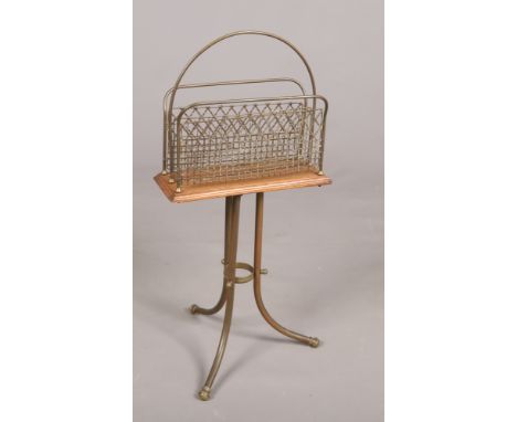 An Edwardian brass tripod magazine stand with rotating top, 77cm.  