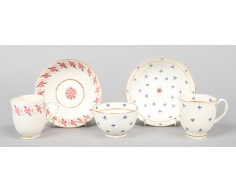 A Caughley trio comprising a teabowl and saucer and coffee cup painted in colours with cornflowers along with a Caughley coff
