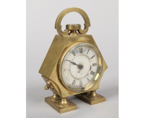 A brass cased table clock with carrying loop incorporating a compass. Having silvered dial with Roman numeral markers and hou