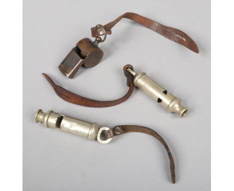 Three whistles. A World War I trench whistle by J. Hudson &amp; Co. Birmingham, dated 1914, with broad arrow mark and having 