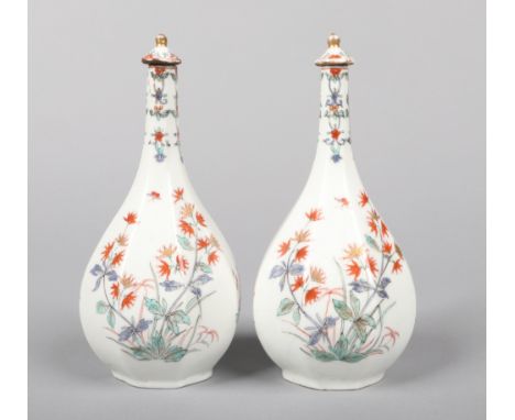 a pair of 19th century Samson Chantilly style octagonal bottle vases and stoppers. Painted in the Kakiemon palette with Orien