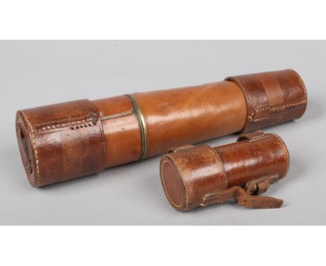 A leather cased World War I three drawer telescope with high and low lenses by Ross of London. Marked 1914, with broad arrow 