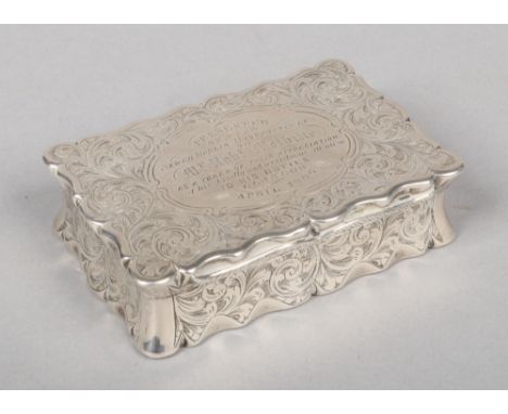 A Victorian silver table snuff box by Hilliard &amp; Thomason. Serpentine in form, with scroll engraved ground and inscribed 