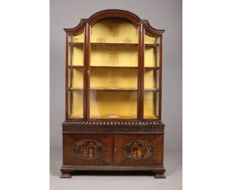 A Chinese Chippendale style mahogany dome top display cabinet. With gadrooned moulding, blind fret carved frieze and decorate