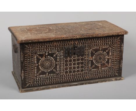 A 19th century Moroccan blanket box inlaid with mother of pearl, 62cm wide.  