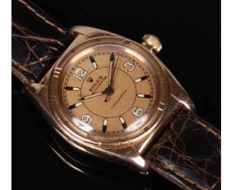 A gentleman's 14 carat gold cased Rolex Oyster Perpetual Chronometer wristwatch. With baton and numeral luminous markers and 