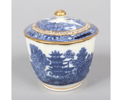 A Caughley fluted sucrier and cover. Printed in underglaze blue with the Pagoda pattern and embellished in gilt. Printed S ma