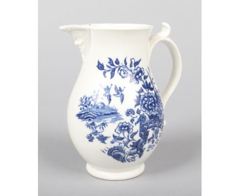 A Caughley baluster shaped mask jug of unusually small size. With scrolling handle having moulded thumb piece and printed in 