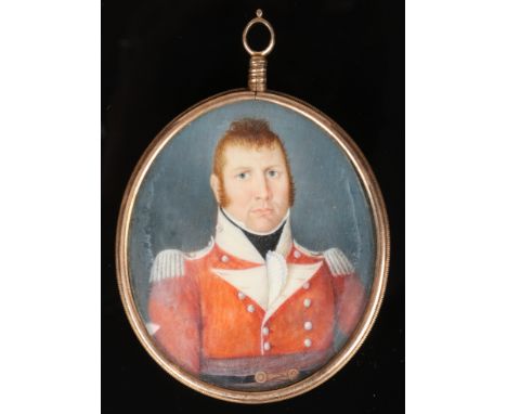 An early 19th century ivory military portrait miniature, gold mounted with milled edge and having brooch and pendant fittings