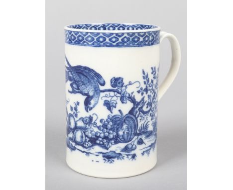 A Caughley cylindrical mug with reeded strap handle. Printed in underglaze blue with the Parrot Pecking Fruit pattern. Printe