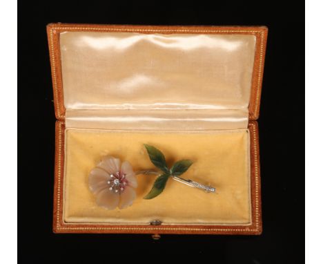A cased 18 carat white gold spray brooch formed as a peony, maker B &amp; S. Its petals carved from rose quartz with a diamon