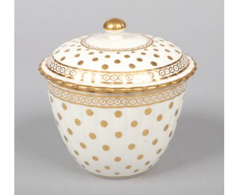 A Caughley fluted sucrier and cover. Decorated in gilt with the Polka Dot pattern c.1780, 11cm high.  Chip to the underside r
