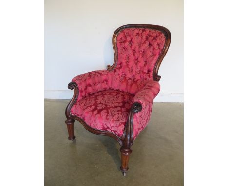 A mahogany button back armchair 