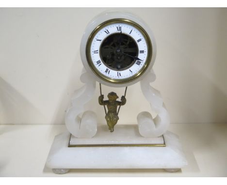 An 8 day Brevett alabaster clock with swinging cherub movement, 24cm tall, running order 