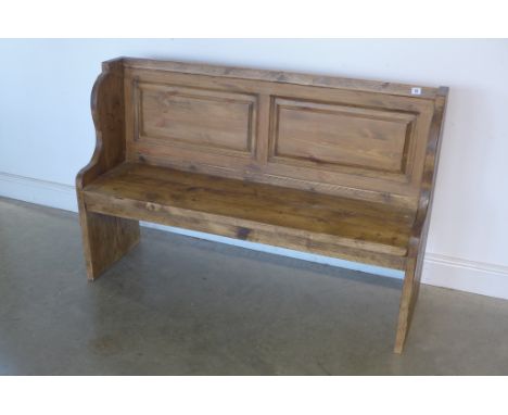 A rustic pine pew with fielded panel back, length 139cm, back height 91cm, seat height 45cm, depth 42cm 