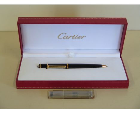 A Cartier roller ball ladies pen with box and refills, in working order, in good condition 