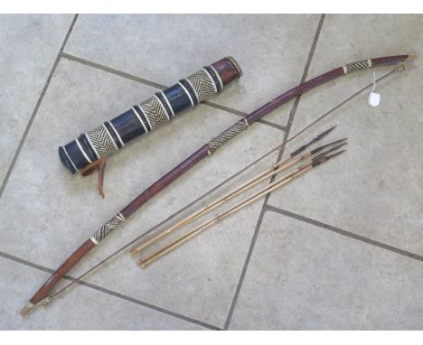 An African bow with quiver and four arrows, bow length 116cm 