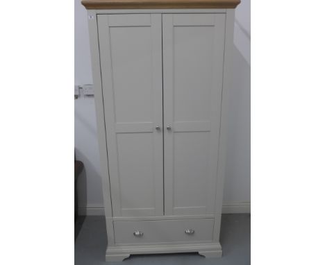 A Furniture Village light grey painted double wardrobe with a base drawer, 196cm H x 97cm W x 58cm D - comes in two parts, in