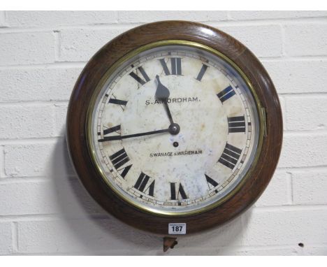 An oak case 9 day 12 inch dial wall clock 