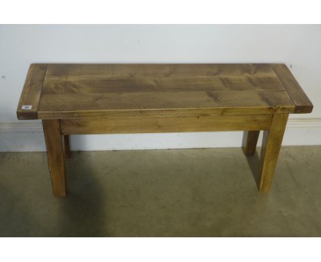 A small rustic pine bench, length 103cm, height 44cm, width 33cm 