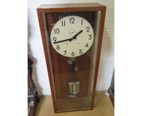 An oak cased double weight Master clock - 84cm x 34cm 