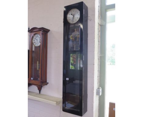 An ebonised synchrome master clock - with three part pendulums 