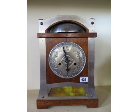 A Liberty style mantel clock with a German movement - Height 37cm x Width 25cm 
Condition report: No pendulum or key 