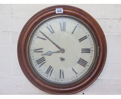 A mahogany cased circular 8 day spring driven wall clock white enamel dial with Roman numerals to chapter ring