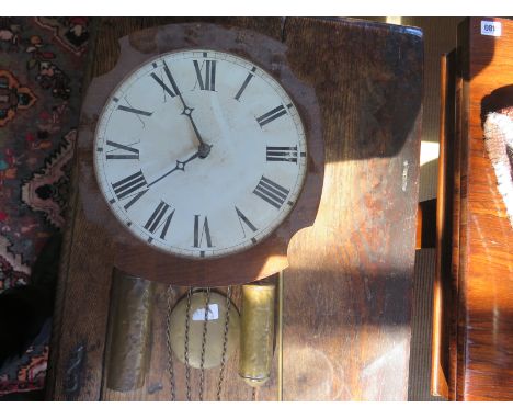 A wall clock with shaped mahogany surround white enamel dial with Roman numerals to chapter ring