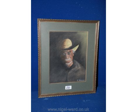 A Watercolour and Chalk Portrait of a Man in a hat, signed Brown