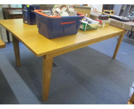 A large modern light oak dining table standing on block legs 30"h x 86"w, together with five benches 