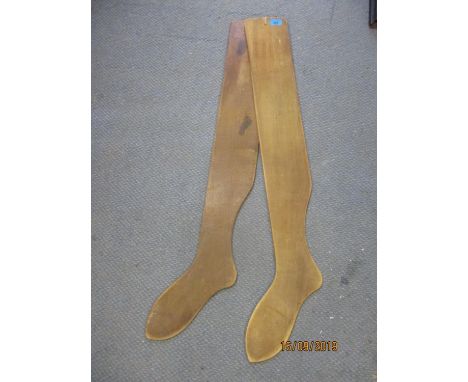 A pair of early 20th century wooden sock/stocking driers, stamped R Long, Dale &amp; Son 