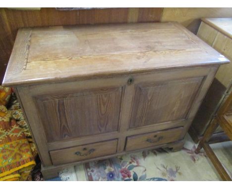 A 19th century pitch pine chest with a hinged top over a panelled front and two drawers, on bracket feet, 33" h x 41"w 