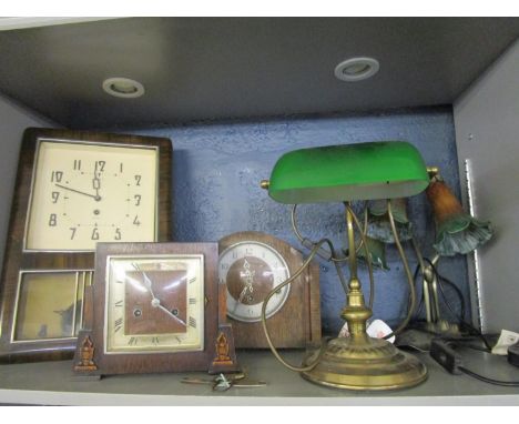 A reproduction three-branch table lamp with glass shades, an office desk lamp with adjustable green shade, two early 20th cen