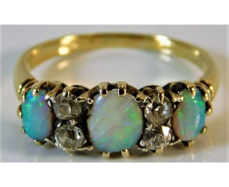 An 18ct gold ring set with opal &amp; diamond 2.6g size N/O