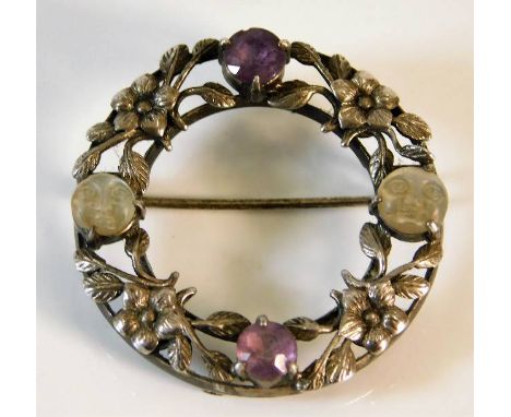 An antique silver brooch set with amethyst &amp; carved faces into moonstone 7.3g 1.5in diameter