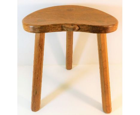 A Robert "mouseman" Thompson carved oak milking stool 17.5in high