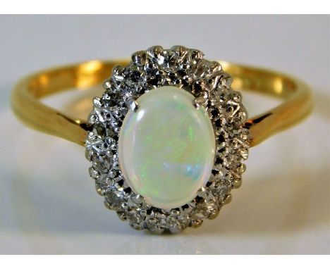 An 18ct gold ring set with opal &amp; diamond 3.2g size S 