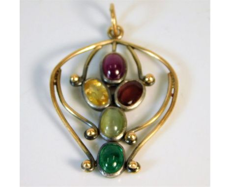 An Edwardian yellow metal pendant, tests as 18ct gold set with ruby, emerald, natural chrysoberyl &amp; other gem stones 4.7g