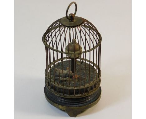 A miniature automaton bird cage clock