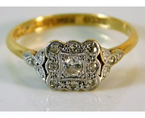 An early 20thC. 18ct ring set with approx. 0.15ct diamonds 2.6g size N/O