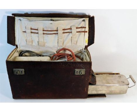 A vintage midwifery case with contents