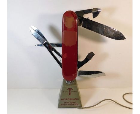 A Victorinox Swiss Army Knife shop display, in working order, some loss to lacquer. Provenance: Formerly the property of Mrs.