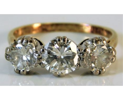 An 18ct gold trilogy ring set with approx. 1.8ct diamonds 3g size L/M 