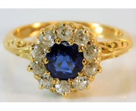 An antique 18ct gold sapphire ring with carved shoulder decor set with approx. 0.6ct old cut diamonds 3.9g size L/M 