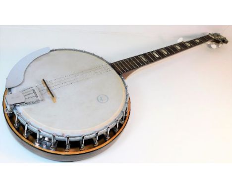 A vintage banjo, some losses to strings