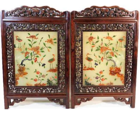 A pair of late 19thC. Chinese carved hardwood framed jade plaques with various semi precious stone applied decor 18in high x 