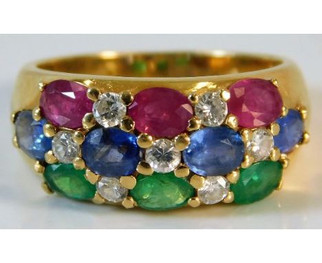 An 18ct gold ring set with approx. 0.28ct diamond, ruby, sapphire &amp; emerald 3.9g size K